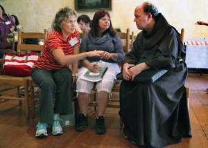 Friar William "Bill" Short addressing questions regarding the Franciscan Order with NEH Landmarks Scholars in 2013